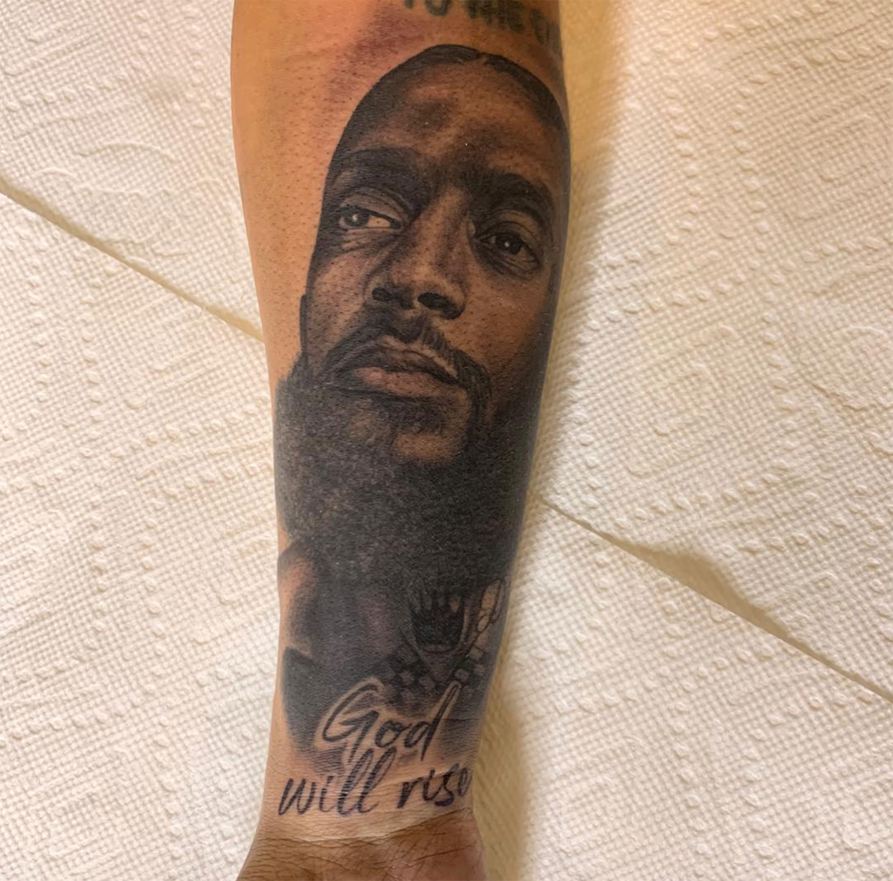 Lauren London's Nipsey tattoo